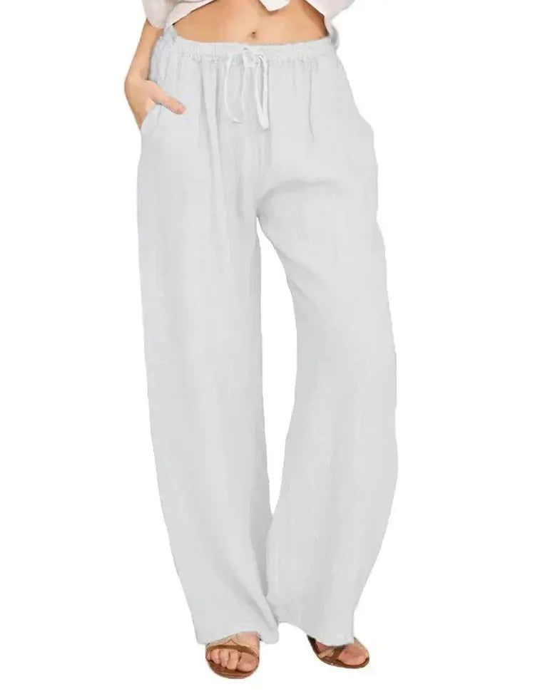 Pantaloni larghi bianchi da donna, vita alta con laccio, tasche laterali, tessuto leggero e traspirante, perfetti per l'estate e il tempo libero.