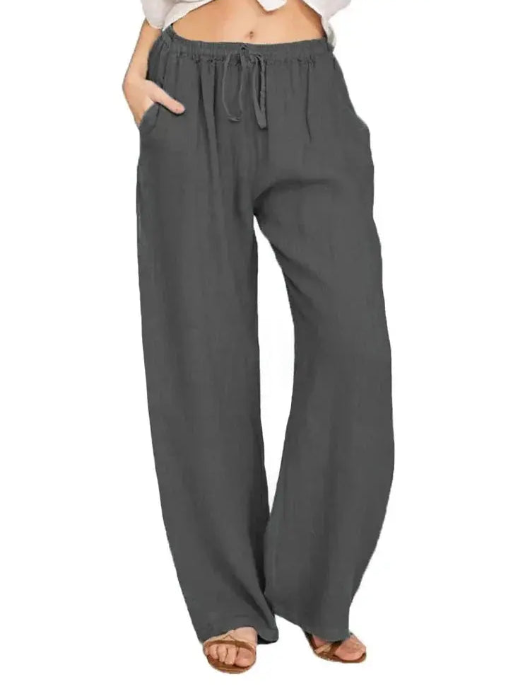 Pantaloni larghi donna in lino grigio, vita alta con coulisse, tasche laterali, stile casual estivo.