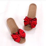 Sandali estivi da donna con fiocco rosso, suola intrecciata beige, design elegante e casual, perfetti per la moda estiva e il comfort quotidiano.