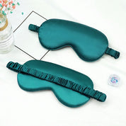 Maschera per dormire in seta verde, design elegante, con elastico regolabile. Accessorio per il sonno, comfort e relax. Ideale per viaggi.