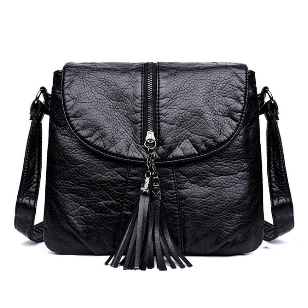 Borsa a tracolla in pelle nera con zip centrale e nappine decorative, design elegante e moderno, ideale per moda donna e accessori.