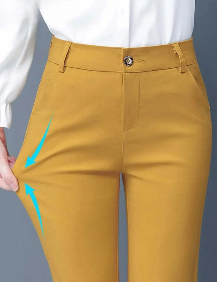 Pantaloni donna giallo senape, vita alta, chiusura con bottone, tessuto elasticizzato, design elegante, perfetti per look casual e formali.