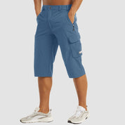 Pantaloncini cargo uomo blu, tasche multiple, lunghezza al ginocchio, stile casual, tessuto leggero, perfetti per attività all'aperto.
