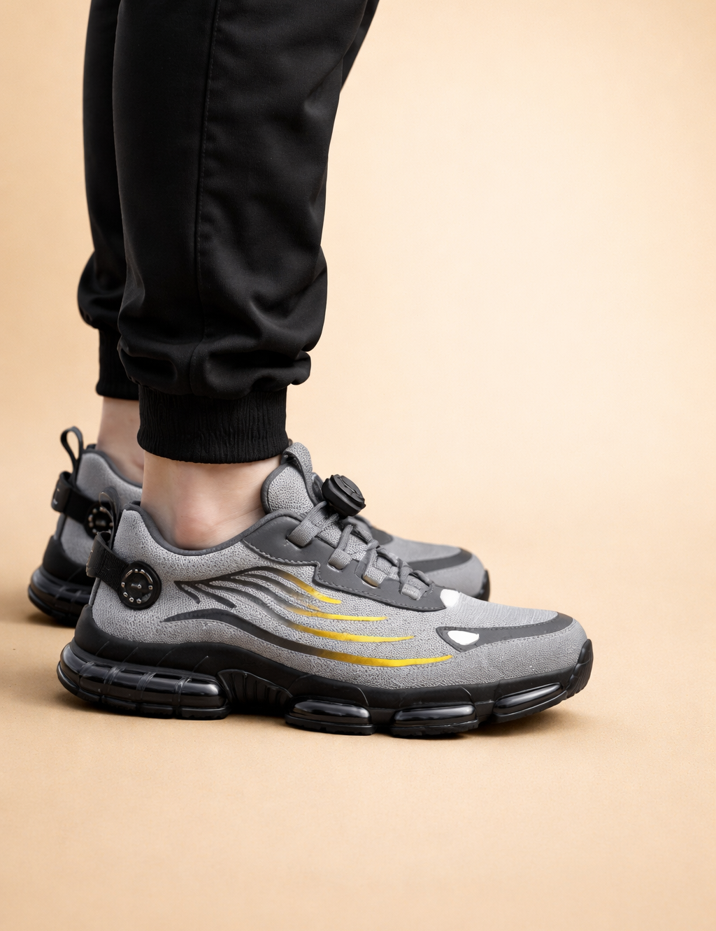 Modern_grey_and_yellow_sneakers_close-up_241bbc10-4a94-4e8e-b4db-1f8faa075e03.png