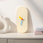 Moderne Wandklok mit farbigen Zeigern 1