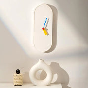 Moderne Wandklok mit farbigen Zeigern 2