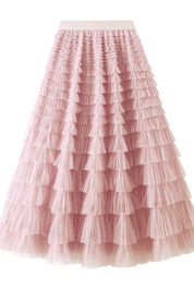 Gonna lunga rosa in tulle a balze, elegante e femminile, perfetta per eventi speciali. Design romantico, moda donna, abbigliamento chic.