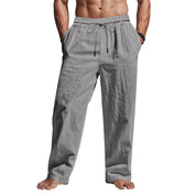Pantaloni uomo grigi in lino, vita elastica con coulisse, tasche laterali, stile casual estivo, comodi e leggeri, perfetti per il tempo libero.