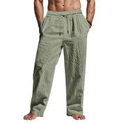 Pantaloni uomo in lino verde chiaro, elastico in vita con coulisse, tasche laterali, stile casual estivo. Ideali per look rilassato e confortevole.