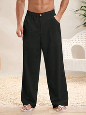 Pantaloni neri da uomo in lino, larghi e comodi, con tasche laterali, ideali per l'estate. Abbigliamento casual elegante.
