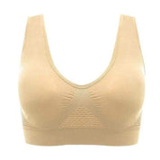 Reggiseno sportivo senza cuciture beige, design a V, supporto confortevole, tessuto traspirante, ideale per attività sportive e quotidiane.