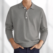 Maglione uomo grigio a maniche lunghe, colletto polo, bottoni bianchi, tessuto morbido, stile casual, perfetto per autunno e inverno.