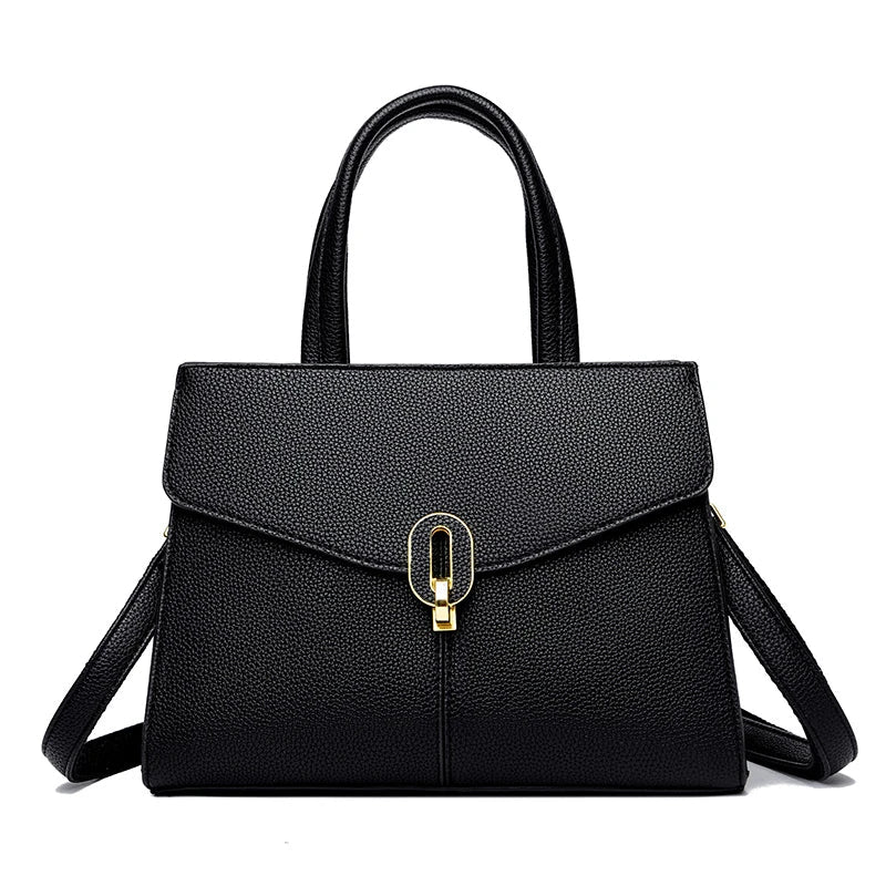 Borsa a mano in pelle nera elegante con chiusura dorata, design moderno, ideale per donna, accessorio moda, perfetta per ogni occasione.