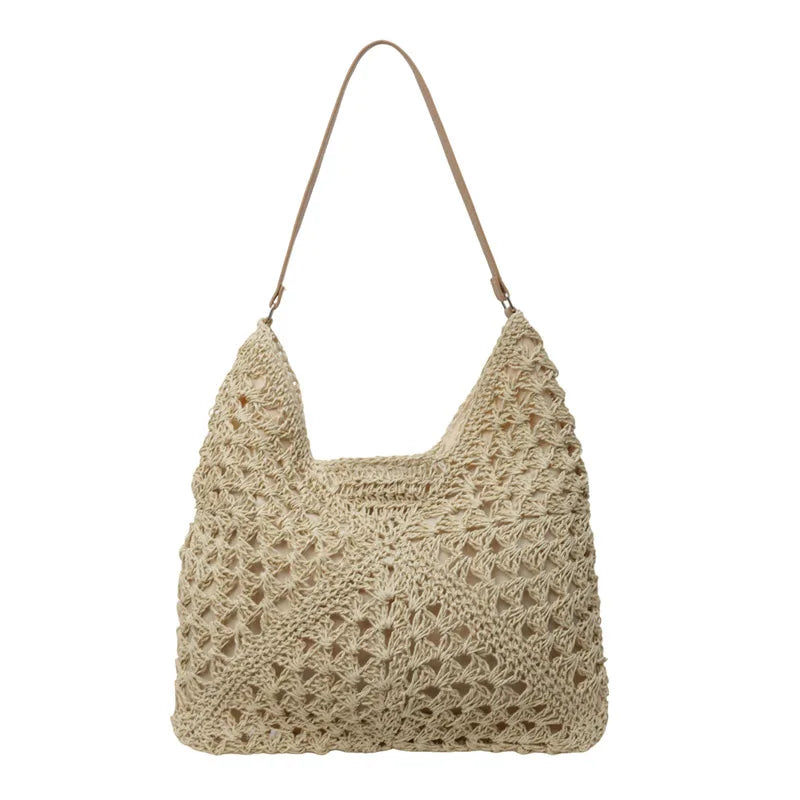 Borsa a spalla in paglia intrecciata beige, design estivo, manico in pelle, moda donna, accessorio casual chic, perfetta per la spiaggia.