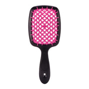 Spazzola per capelli nera con setole rosa, design rettangolare, ideale per districare e lisciare. Accessorio essenziale per la cura dei capelli.