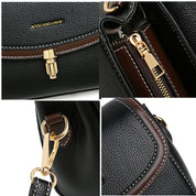 Borsa a tracolla in pelle nera con dettagli dorati, cerniera robusta e cuciture marroni. Design elegante e moderno, perfetto per ogni occasione.