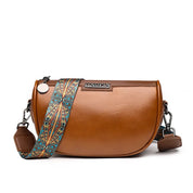 Borsa a tracolla in pelle marrone con cinturino decorato colorato, design elegante e moderno, perfetta per moda donna e accessori di tendenza.