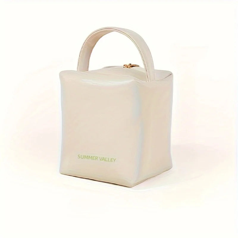 Borsa a mano beige in pelle, design cubico, marchio Summer Valley, chiusura superiore con zip, elegante e moderna, accessorio moda donna.