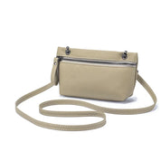 Borsa a tracolla beige in pelle con cerniera frontale, design elegante e minimalista, ideale per moda donna, accessori versatili e pratici.