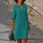 Abito verde donna, maniche 3/4, scollo a V, stile casual. Perfetto per moda estiva, passeggiate all'aperto. Elegante e confortevole.
