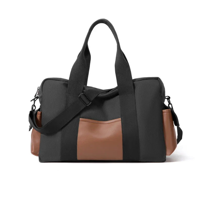 Borsa a tracolla nera e marrone, design elegante, tasche laterali, manici robusti, ideale per viaggi e uso quotidiano. Accessorio moda versatile.