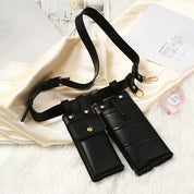 Cintura in pelle nera con doppia custodia, design elegante e funzionale, ideale per accessori moda e praticità quotidiana.