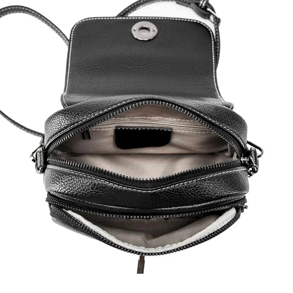 Borsa a tracolla in pelle nera con cerniere multiple, design compatto, ideale per donna. Interno spazioso, perfetta per uso quotidiano.