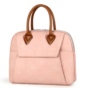 Borsa a mano in pelle rosa con manici marroni, design elegante e moderno, ideale per moda femminile, accessorio di tendenza per ogni occasione.