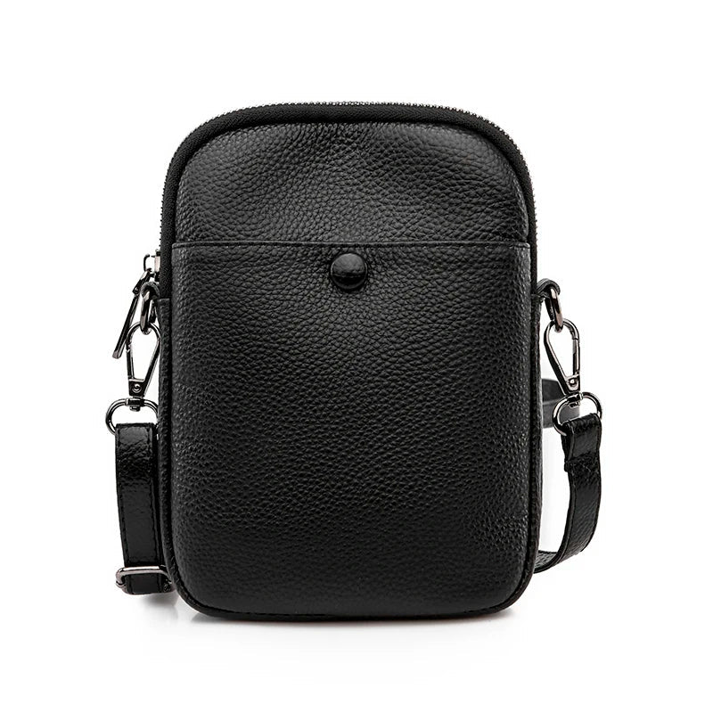 Borsa a tracolla in pelle nera, design compatto, chiusura con zip e bottone, ideale per uomo e donna, accessorio moda elegante e pratico.