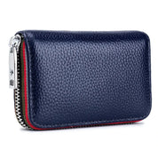 Portafoglio in pelle blu scuro con cerniera argentata, design compatto e texture a grana, ideale per uomo e donna. Accessorio moda elegante.