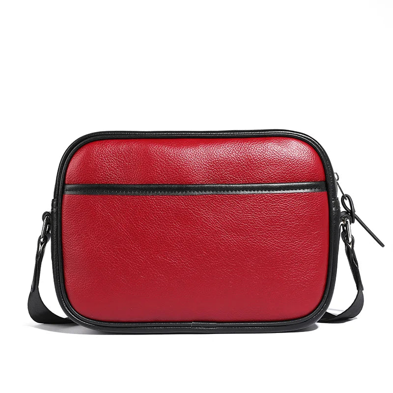 Borsa a tracolla in pelle rossa, design elegante con cerniera nera, ideale per moda donna, accessorio versatile e di tendenza.