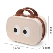 Valigia per bambini beige con occhi decorativi, dimensioni 31x23x15 cm, manico marrone, ideale per viaggi e scuola.