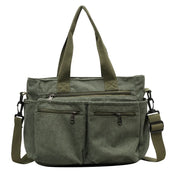 Borsa a tracolla verde in tessuto a coste, con manici e tasche multiple con cerniera. Design casual, ideale per uso quotidiano e viaggi.