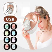 Maschera LED per terapia della pelle, ricaricabile USB, con 7 colori per trattamenti viso anti-età e acne. Donna che la indossa.