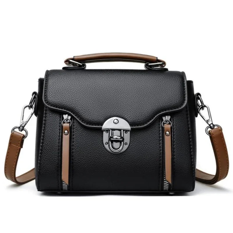 Borsa a tracolla in pelle nera con manico marrone, chiusura a scatto in metallo, design elegante e moderno, ideale per moda donna e accessori.