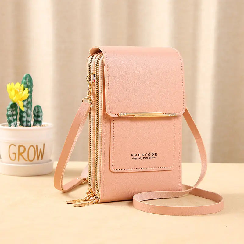 Borsa a tracolla rosa in pelle PU con chiusura a zip, tasche multiple e cinturino regolabile. Accessorio moda elegante per donna.