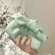 Borsa a mano verde menta con fiocco, design elegante e moderno, perfetta per moda femminile, accessorio chic per eventi e uscite casual.
