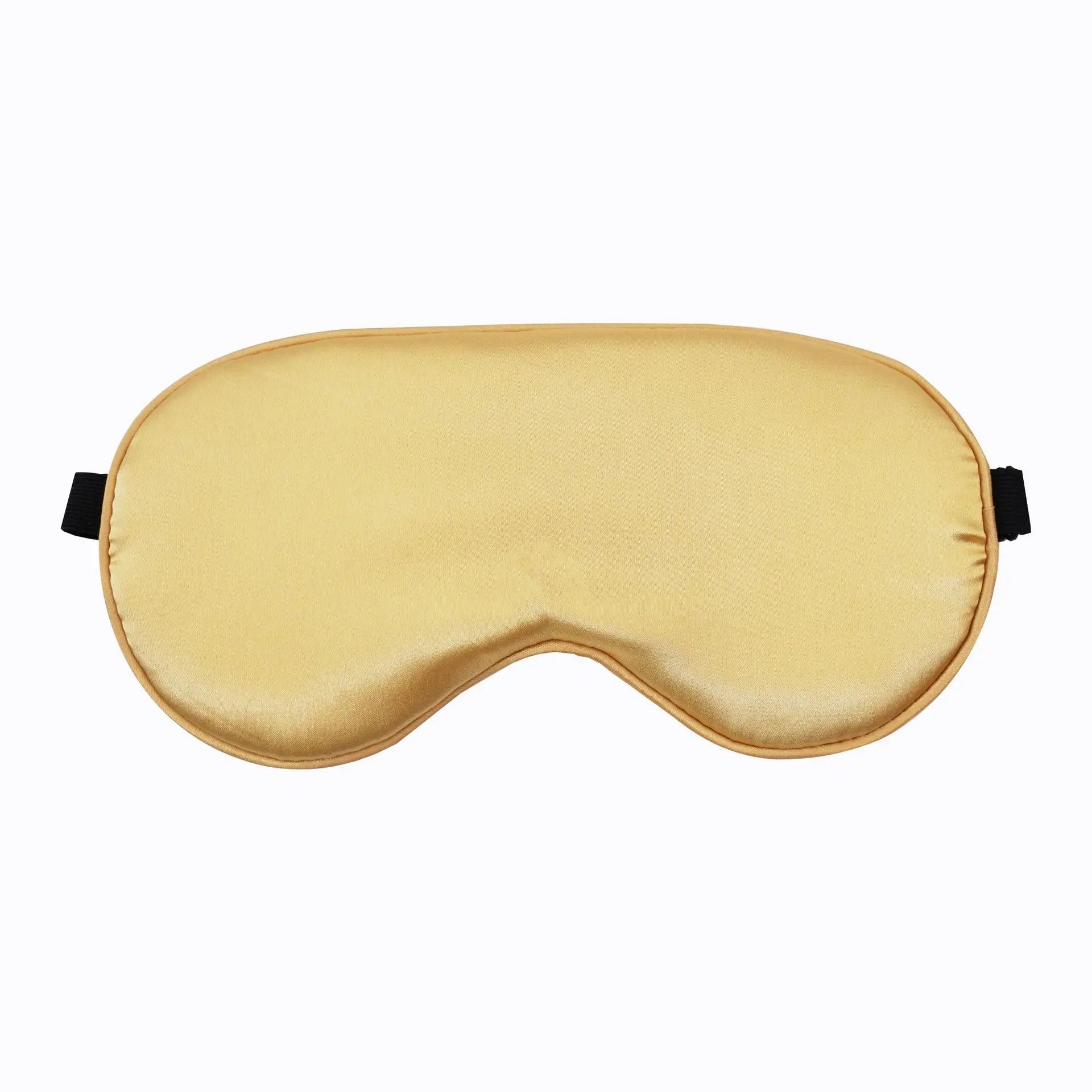 Maschera per dormire in seta dorata, elegante e confortevole, ideale per un sonno riposante. Accessorio perfetto per viaggi e relax.