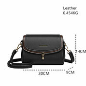 Borsa a tracolla in pelle nera, dimensioni 20x9x14 cm, peso 0,454 kg, con chiusura a fibbia dorata e dettagli marroni. Accessorio moda elegante.