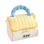 Borsa termica per bambini, design a righe gialle e beige, manico imbottito blu con scritta "Lucky", chiusura a zip, ideale per scuola e picnic.