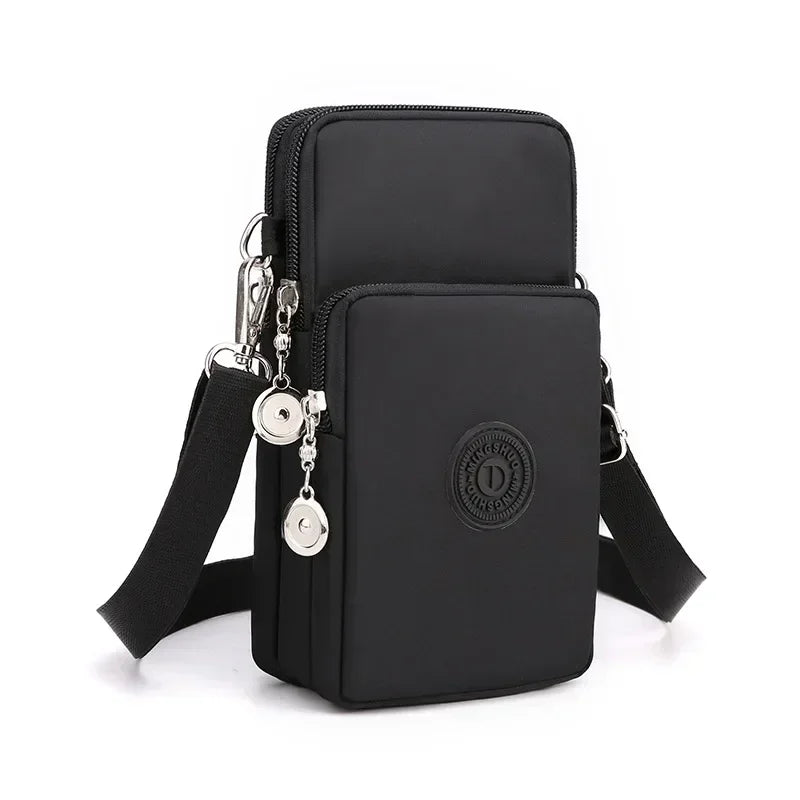 Borsa a tracolla nera multifunzione in nylon, design compatto con doppia cerniera, tasche multiple e tracolla regolabile, ideale per viaggi e uso quotidiano.