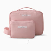 Set di borse da trucco rosa, due pezzi, con manico e chiusura lampo. Ideale per organizzare cosmetici. Design elegante e pratico.