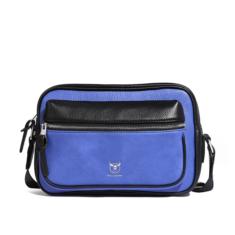 Borsa a tracolla unisex in pelle blu e nera, con tasca frontale con zip e logo. Design elegante e moderno, ideale per uso quotidiano.