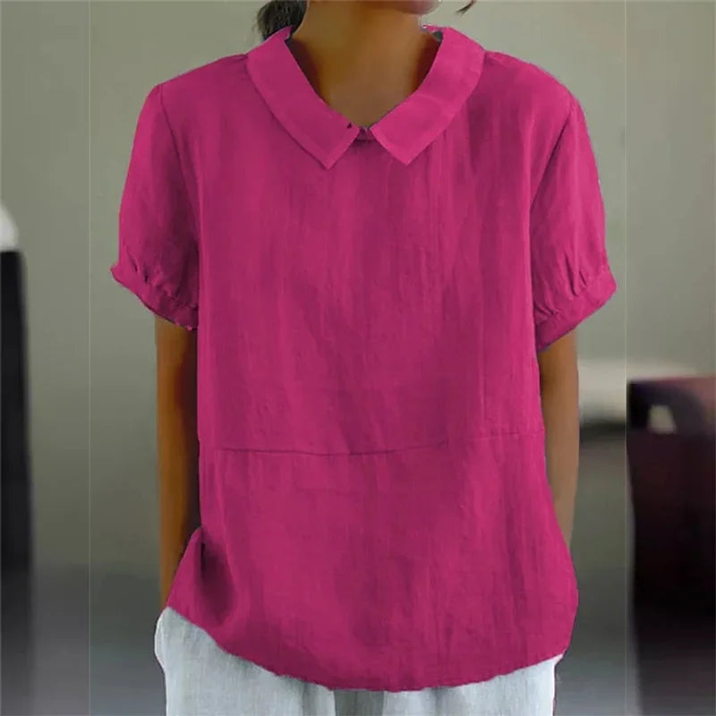 Blusa donna rosa fucsia, maniche corte, colletto classico, tessuto leggero. Ideale per look casual ed estivi. Moda femminile elegante.