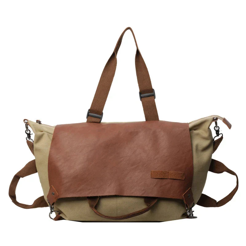 Borsa a tracolla in tela e pelle marrone, design vintage, con manici regolabili e chiusura a zip. Ideale per viaggi e uso quotidiano.