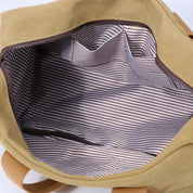 Borsa tote in tela beige con interno a righe bianche e marroni, spaziosa e resistente, ideale per shopping e uso quotidiano.