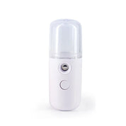 Umidificatore portatile bianco, nebulizzatore viso ricaricabile USB, design compatto, ideale per idratazione pelle e cura del viso.