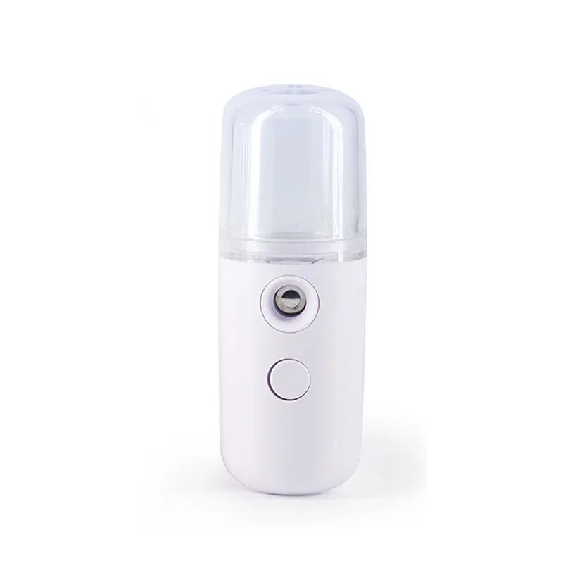 Umidificatore portatile bianco, nebulizzatore viso ricaricabile USB, design compatto, ideale per idratazione pelle e aromaterapia.