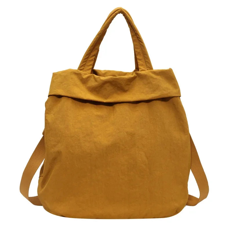 Borsa a tracolla in tessuto giallo senape, design moderno, manici doppi, ideale per shopping e uso quotidiano. Accessorio moda versatile.
