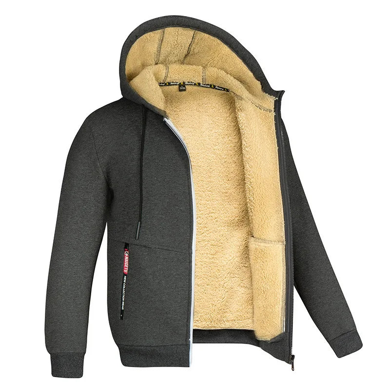 Giacca invernale con cappuccio, interno in pelliccia sintetica beige, esterno grigio scuro, zip frontale, tasche laterali. Abbigliamento caldo uomo.